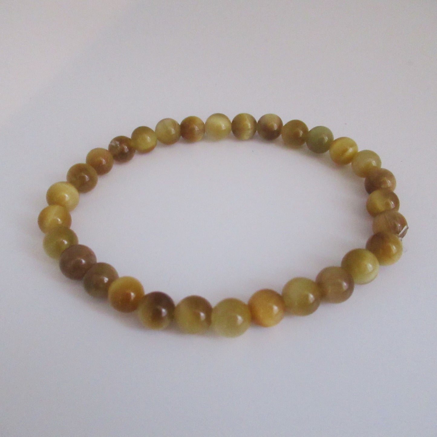 Bracelet Oeil de tigre doré Femme/Homme en pierres naturelles - 6 mm https://monjolicaillou.fr/products/bracelet-oeil-de-tigre-dore-femme-homme-en-pierres-naturelles-6-mm