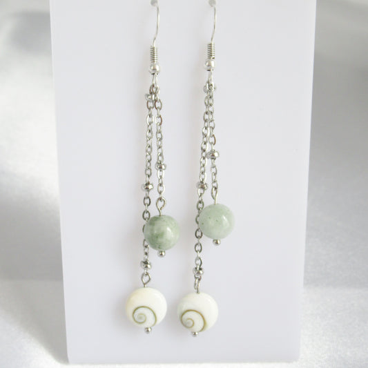 Boucles d'oreilles - Oeil de Sainte Lucie - Jade de Birmanie

Ajoutez une touche de charme et de protection à votre quotidien avec nos boucles d'oreilles en Oeil de Sainte Lucie et Jade de Birmanie. Véritable porte-bonheur, l'Oeil de Sainte Lucie favorise la réussite et éloigne le mauvais œil, renforçant ainsi votre confiance en vous. Le Jade de Birmanie, pierre de paix 