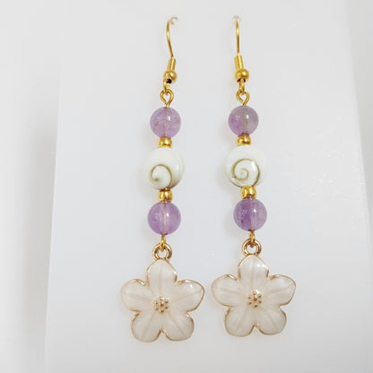 Découvrez nos boucles d'oreilles en Œil de Sainte-Lucie et pierres naturelles. Bouclier de protection, sérénité et vitalité au quotidien. Trouvez votre pierre !