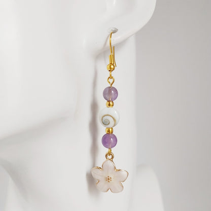 Découvrez nos boucles d'oreilles en Œil de Sainte-Lucie et pierres naturelles. Bouclier de protection, sérénité et vitalité au quotidien. Trouvez votre pierre !