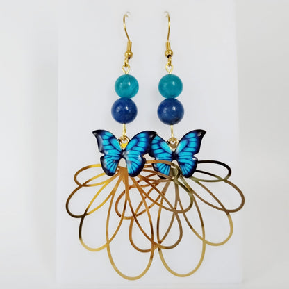 Boucles d’oreilles en Apatite AAA et Lapis Lazuli AA avec symbole papillon. Bijoux énergétiques pour l’expression, la confiance et la transformation intérieure. Élégance et puissance au quotidien.
