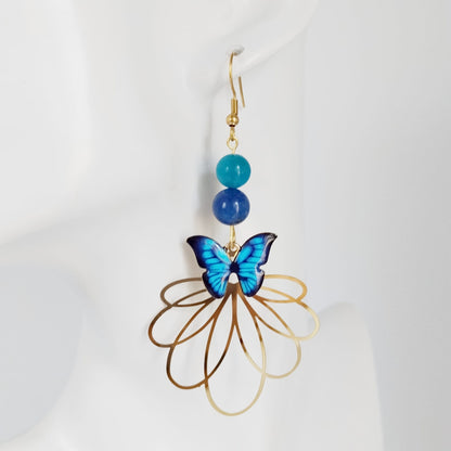 Boucles d’oreilles en Apatite AAA et Lapis Lazuli AA avec symbole papillon. Bijoux énergétiques pour l’expression, la confiance et la transformation intérieure. Élégance et puissance au quotidien.

