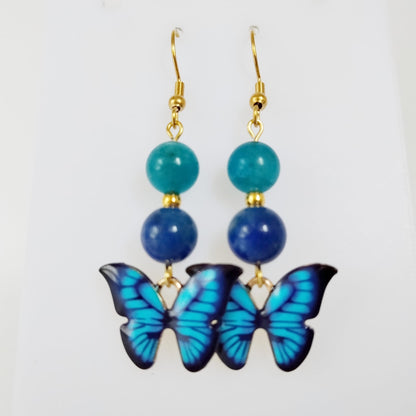 Boucles d’oreilles en Apatite AAA et Lapis Lazuli AA avec symbole papillon. Bijoux énergétiques pour l’expression, la confiance et la transformation intérieure. Élégance et puissance au quotidien.
