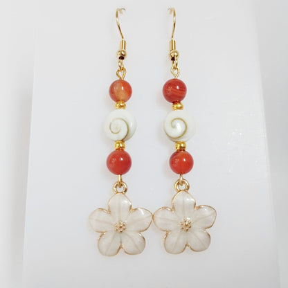 Découvrez nos boucles d'oreilles en Œil de Sainte-Lucie et pierres naturelles. Bouclier de protection, sérénité et vitalité au quotidien. Trouvez votre pierre !