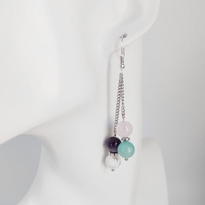 Découvrez nos boucles d'oreilles anti-stress en pierres naturelles. Une synergie apaisante de 4 pierres pour chasser les peurs et retrouver une vie sereine. 2 modèles au choix.