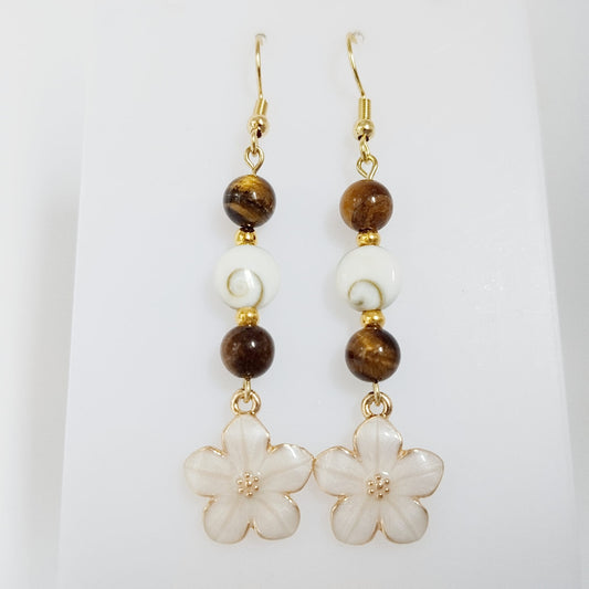 Découvrez nos boucles d'oreilles en Œil de Sainte-Lucie et pierres naturelles. Bouclier de protection, sérénité et vitalité au quotidien. Trouvez votre pierre !