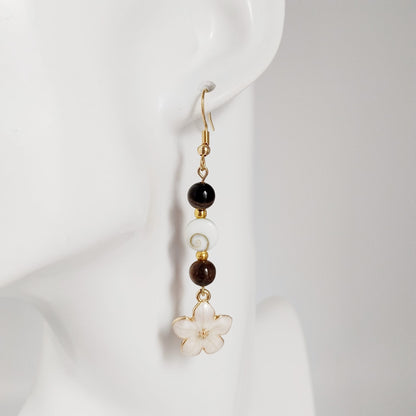 Découvrez nos boucles d'oreilles en Œil de Sainte-Lucie et pierres naturelles. Bouclier de protection, sérénité et vitalité au quotidien. Trouvez votre pierre !
