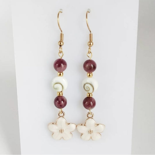 Boucles d’oreilles en pierres naturelles Œil de Sainte Lucie et Tourmaline Rose – bijou élégant de protection et d’amour. Favorise la paix intérieure et la douceur du cœur.