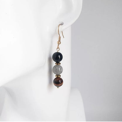 Boucles d’oreilles Triple Protection en Tourmaline, Labradorite et Œil de Tigre. Bijou doré ou argenté pour allier élégance et protection énergétique.