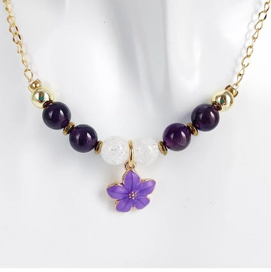 Découvrez l’harmonie parfaite entre l’Améthyste et le Cristal de Roche avec ce collier en pierres naturelles. Alliant élégance et bienfaits énergétiques, il sera votre allié au quotidien. Vertus de l’Améthyste : - Apaise le stress et favorise le calme mental. - Aide en cas de troubles obsessionnels compulsifs (TOC). - Renforce l'estime de soi, idéal pour la méditation et la prise de parole en public. - Stimule intuition, rêves et développement spirituel. - Favorise la réussite professionnelle et personnelle